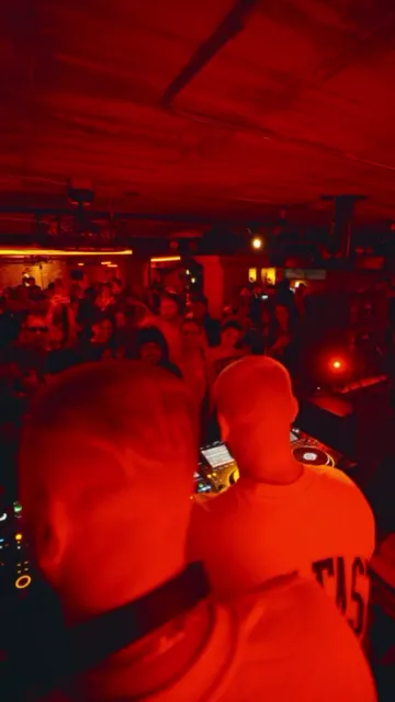 The crowd under the neon sign